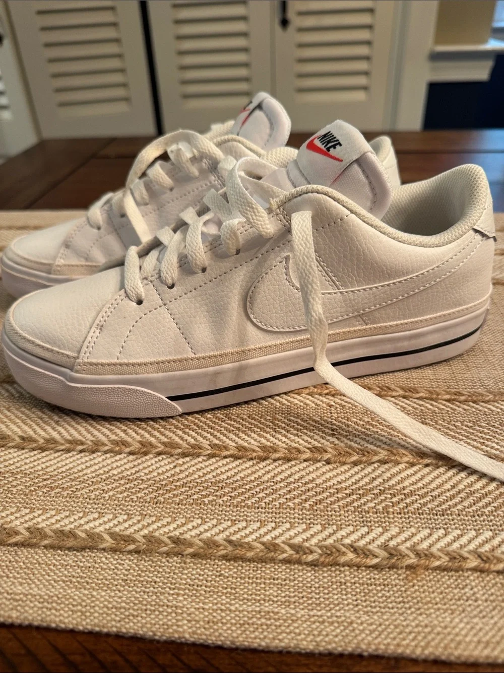 Nike White Low-Top Sneakers with Red Tongue Logo